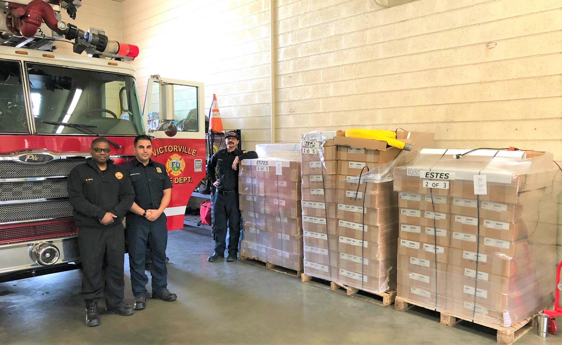 Victorville Fire Personnel receiving donated fire hose from Firehouse subs Public Safety Foundation