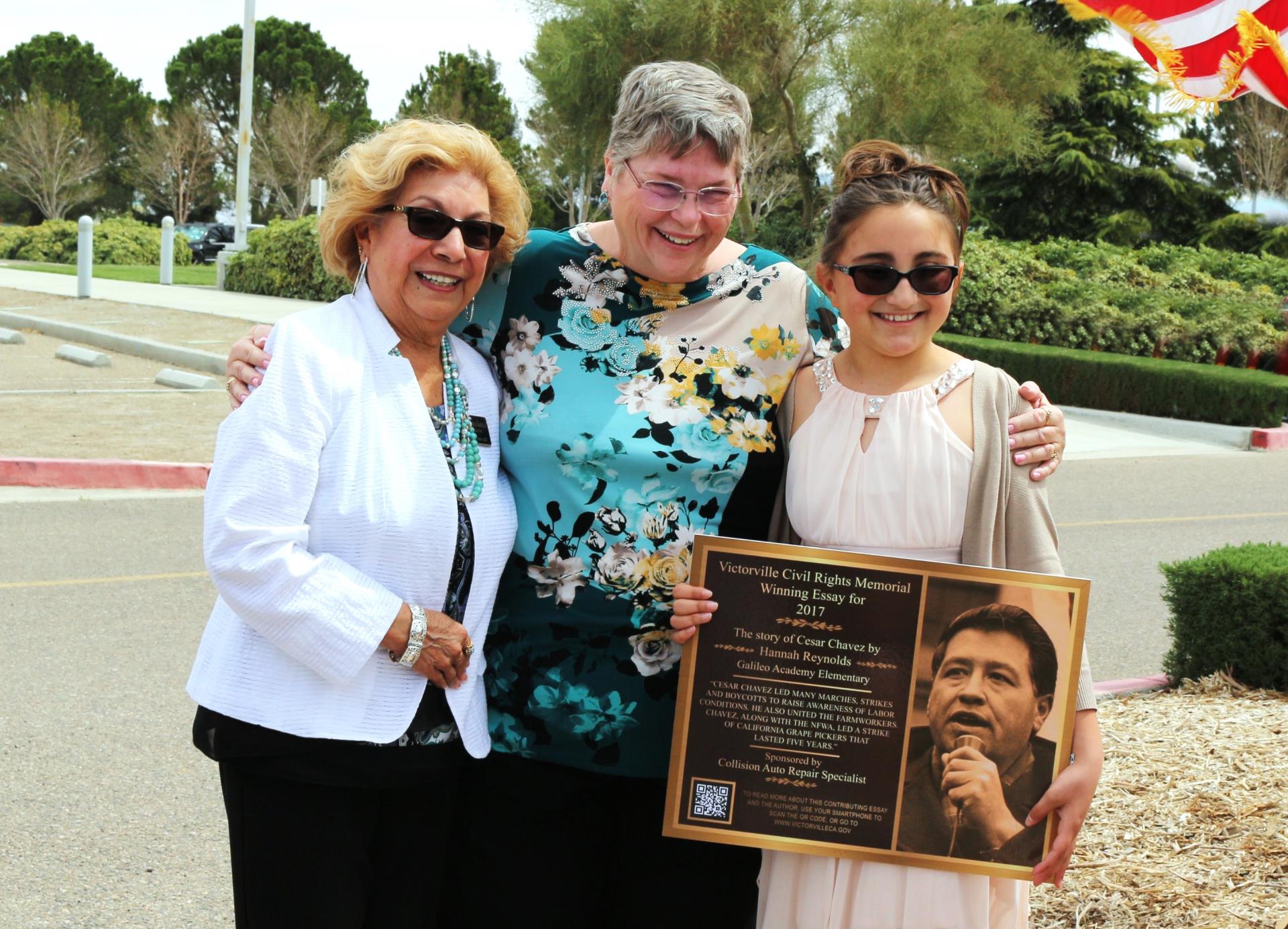 Civil Rights Essay Winner, Hannah Reynolds is pictured with school superintendent and Victorville Mayor