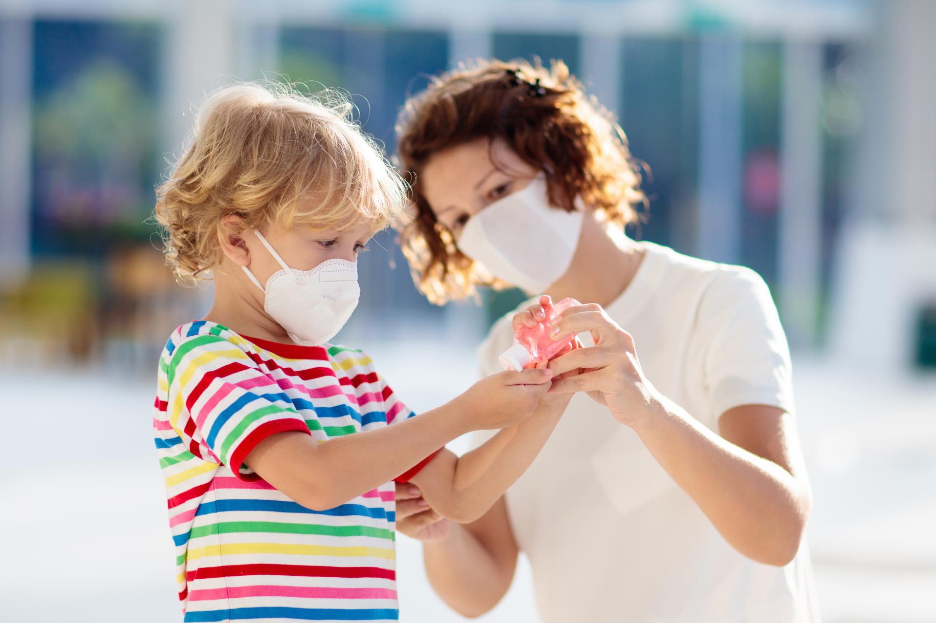 Mother and Child with Masks and Hand Sanitizer